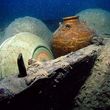 A jar from Vietnam and celadon bowls from the kilns of Longquan discovered on the wreck of the Santa Cruz.