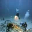 Archaeological divers carefully excavate the Lena junk in 48 metres depth.
